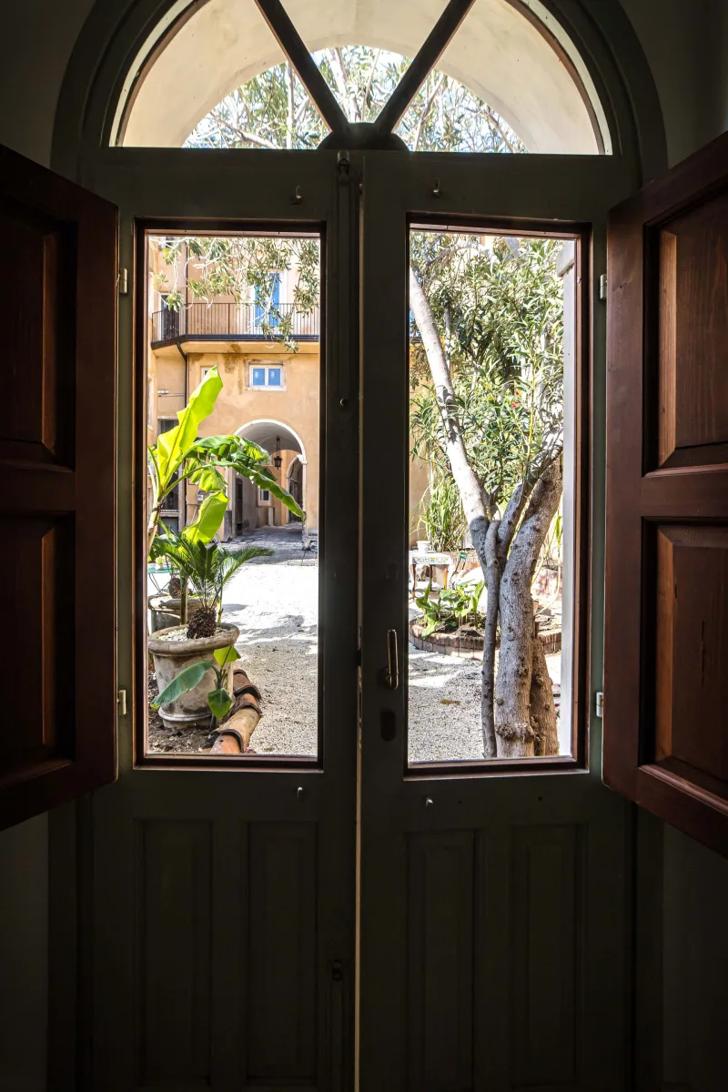 Wooden French doors opening onto the garden