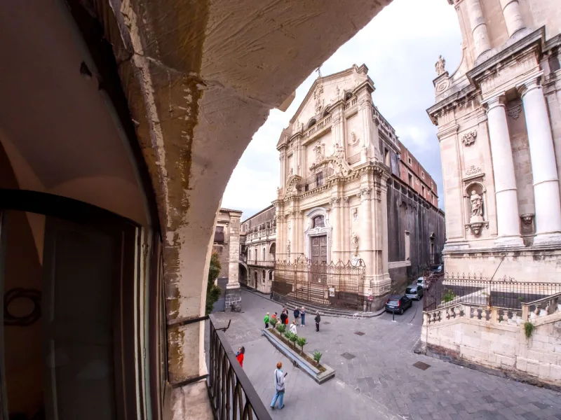 Baroque church in Catania seen from a balcony arch