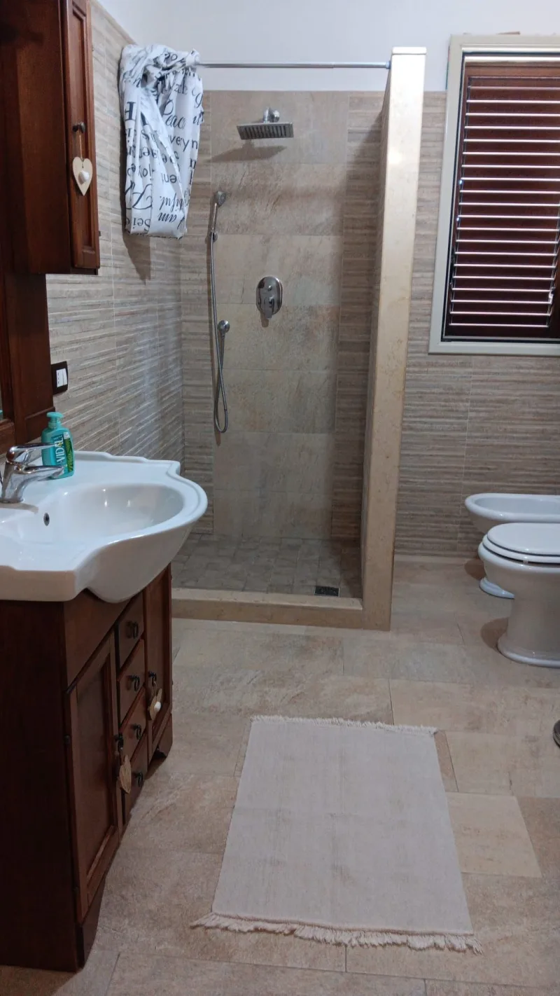 Bathroom with shower and vanity